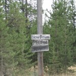 Sign going into Polebridge, Montana...on gravel road.